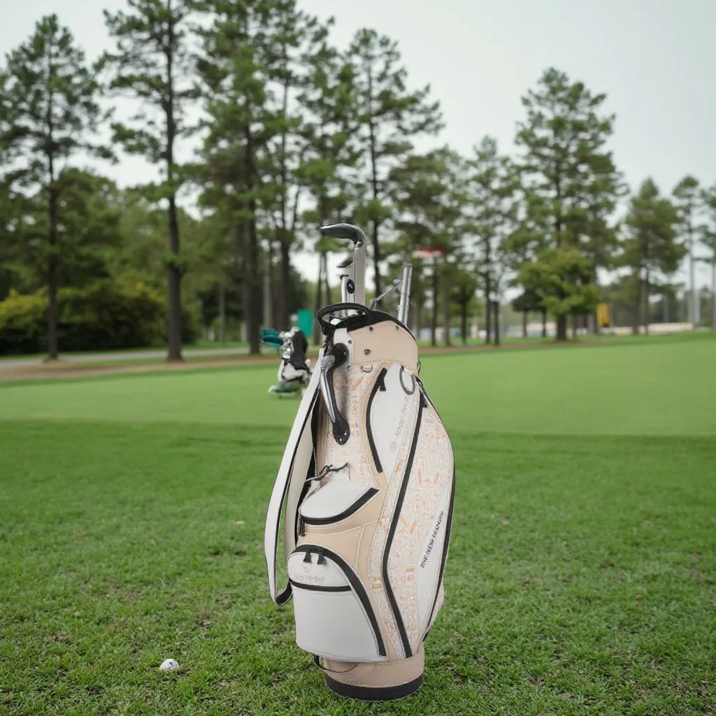 Custom staff golf bag with metal logo plate and tour-grade hardware in a showroom setting