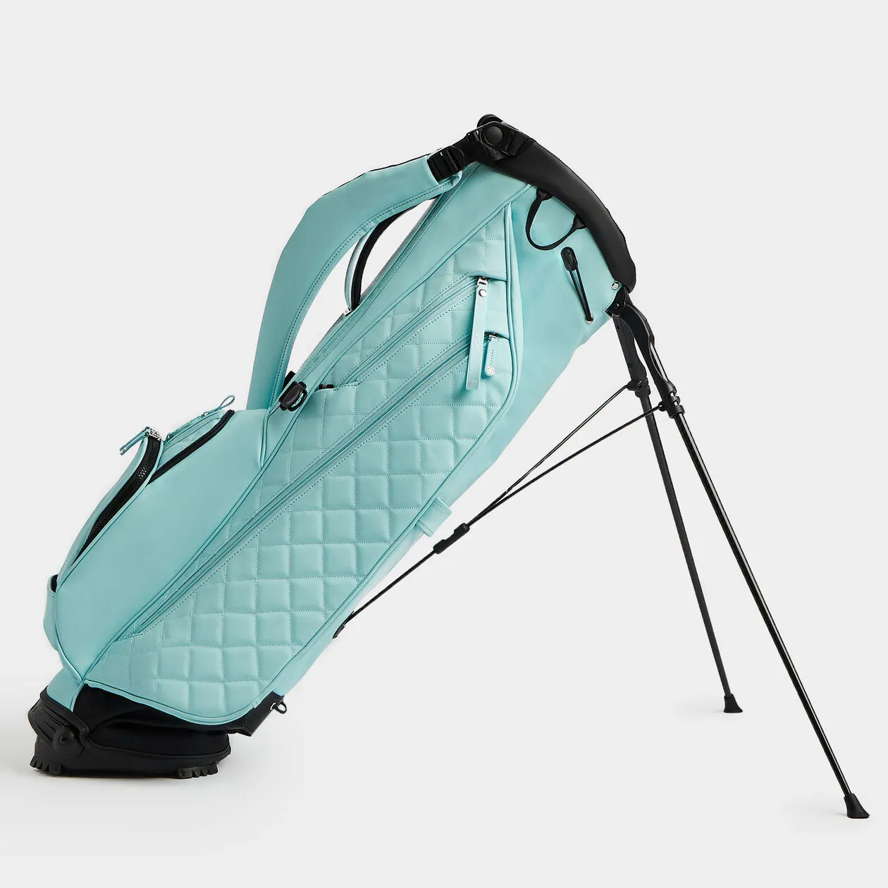 A refined compact custom golf bag in restrained colorway representing the Japanese gift-tier program